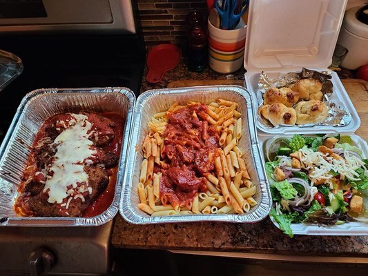 1 order of Chicken Parmigiana, with penne pasta (marinara), garlic knots and side salad. Service for 2 - I could feed 4 on this.