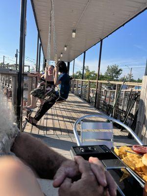 Swings on the upper deck.