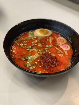 Spicy Ramen -tonkotsu broth, pork belly, half egg, bamboo shot, corn , fish cake, rosted seaweed, chili base, chili oil, green onion.