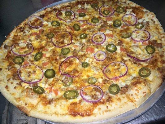 Chicken and sausage with a chipotle sauce base, diced tomatoes, red onions, jalapenos, mozzarella, Monterey jack and cheddar cheese pizza