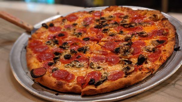 Pepperoni pizza with mushrooms and olives