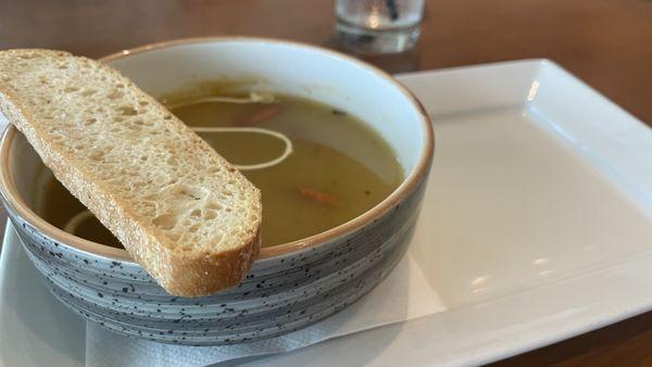 Green Tomato & Spring Onion Soup. With garlic focaccia crostini, tomato. garlic, topped with créme fraiche on top. Unique with deep flavors