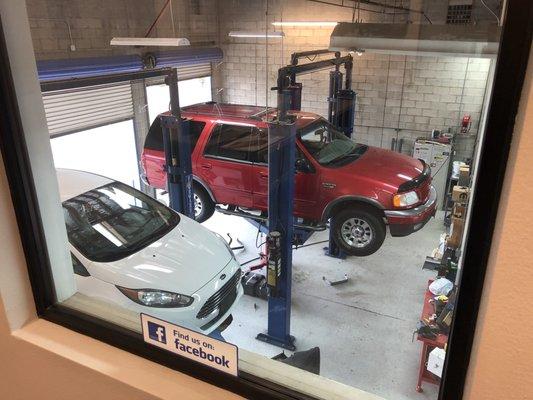 View out of waiting room windows down Down onto the cars.