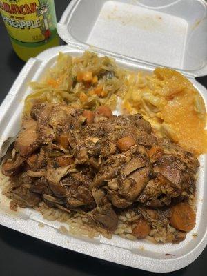 Brown stew chicken, rice and peas, cabbage, and Mac n cheese