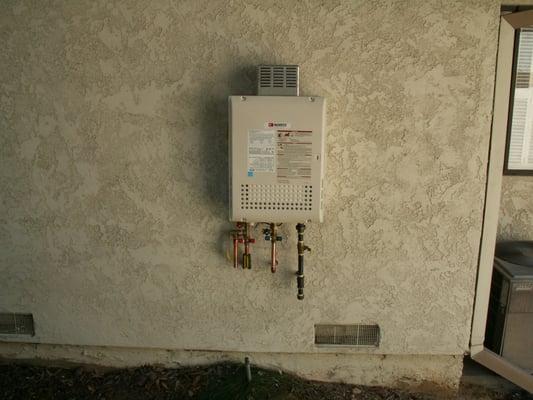 Tankless Water Heater Installation
 
 unit mounted outdoors on side of garage...installed by OneStop Plumbers