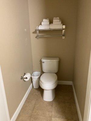 Toilet is separate from the sink in the master bedroom