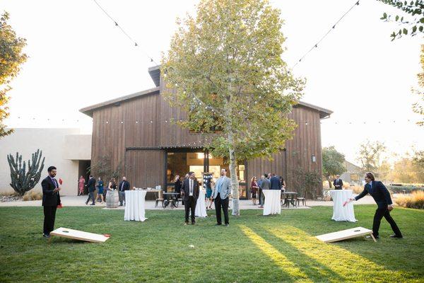 Cocktail hour by the modernized barn at this equestrian center venue in Riverside County