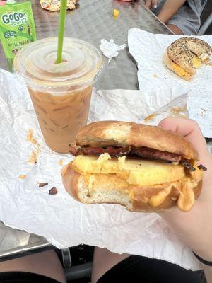 Bacon egg and cheese on plain bagel with iced coffee