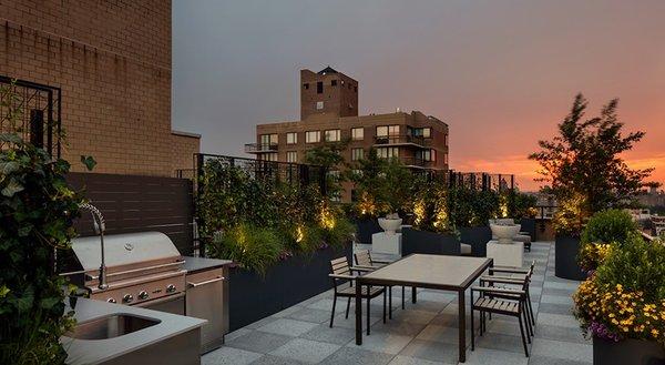 Rooftop BBQ and picnic area at dusk