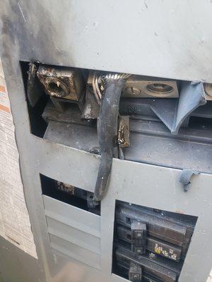 wires being pulled from panel from excavator, panel exploded