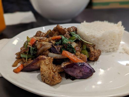 Fish filet and eggplant with basil leaves