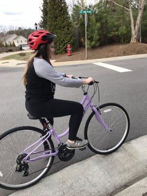 Beginning the test drive to see how the bike fits and how she likes it