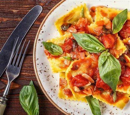 Handmade ricotta and spinach filled ravioli