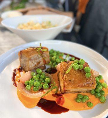 Double Cooked Pork Belly w/ whipped carrots with dill, sweet peas, roasted onion, master jus | $42