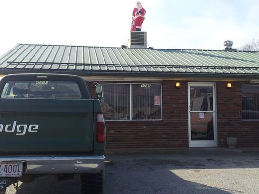 Yep. A rifle in the truck and a plastic Santa on the roof.