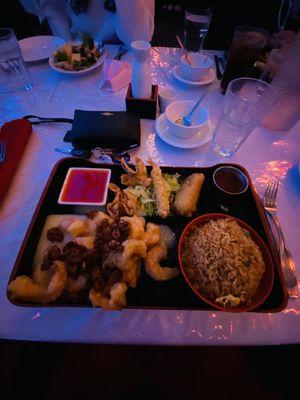 Walnut shrimp dinner platter and empty bowl of egg drop soup.