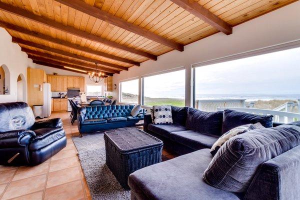 This lush and moody interior offers space for up to 14 and panoramic ocean views. 
 vacasa.com/usa/Oregon/Rockaway-Beach