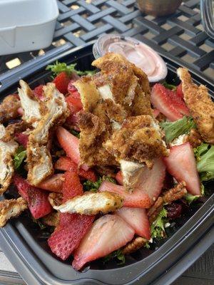 Enjoying a strawberry summer salad with crispy chicken!