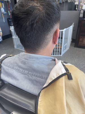 Side/rear view of a mullet hawk fade