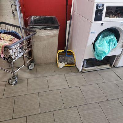 Broom/dustpan left out. Clean up while waiting for your clothes instead of complaining