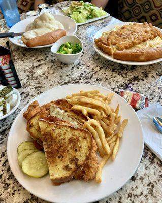 Garlic Crusted Chicken Panini in front Country Fried Steak Dinner in back and Garlic Crusted Chicken Alfredo Pasta Dinner on right..