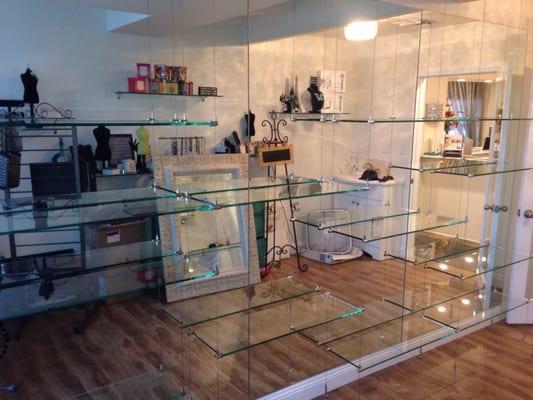 Suspended glass shelving with wire cables at Plush Medi-Spa in downtown Camarillo.