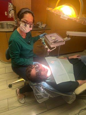 Dr. Angela giving Matthew is annual cleaning.   Thank you Indian Hills Dental for all that you do for us.