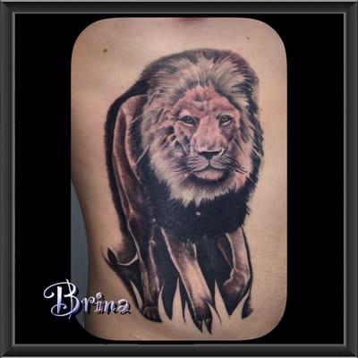 Lion tattoo by Brina