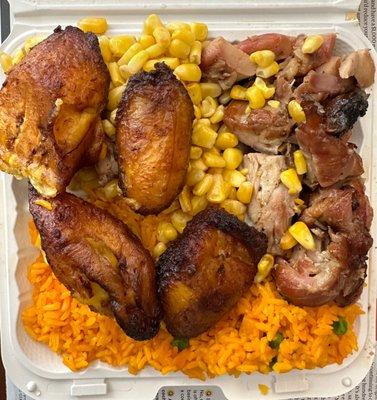 Bourbon chicken and yellow rice with sweet plantains and corn