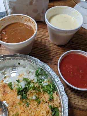 Cheese dip, salsa, beans and rice