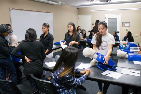 The students receive hands-on practice with mannequins!