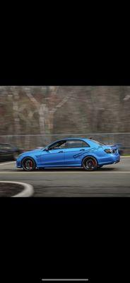 This Mercedes E63 AMG is fully wrapped in satin blue titanium and is our company vehicle.