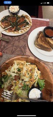 Flat Bread Pizza grilled cheese with tomatoes and grilled onions and a taco salad