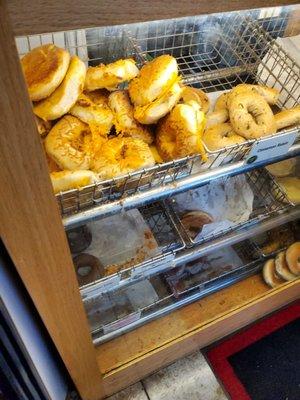 Fresh variety of bagels and muffins