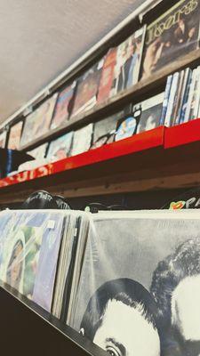 Crates and shelves with vinyl records.