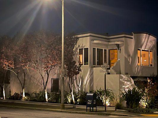 Painted house, built mini fence along sidewalk, revitalized garden, added lighting and trimmed trees