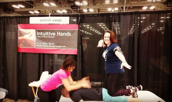 Having some fun providing therapy!  Tapotement on the back and Christy compressing and stretching the hamstrings - Naturally Fit Games 2016