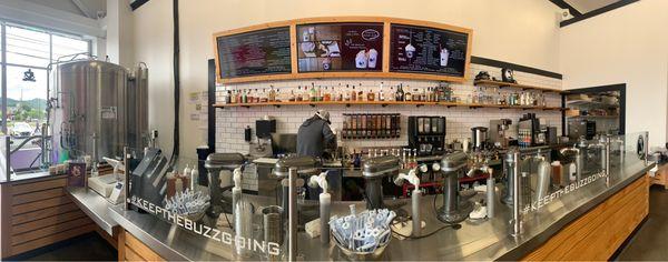 Counter of the bar and mixing stations. Menus in background.