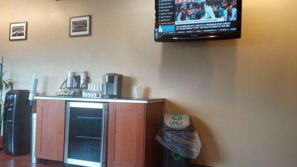 Complimentary drinks and waiting room TV