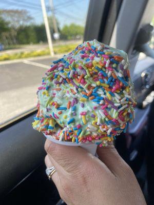 Sizable small pistachio soft serve with rainbow sprinkles