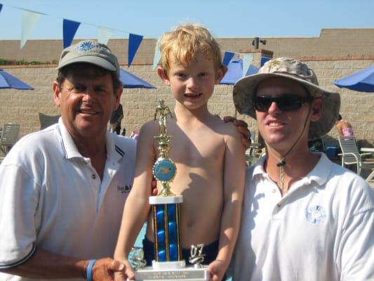 Swim Meet Trophy with Coach Johnny & Coach Eric