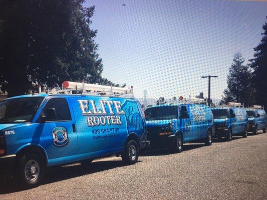 Fleet of Elite Rooter vans lined up, ready to deliver reliable plumbing services to the community.