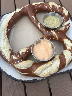 HAND-TWISTED BAVARIAN PRETZEL with cheese and mustard