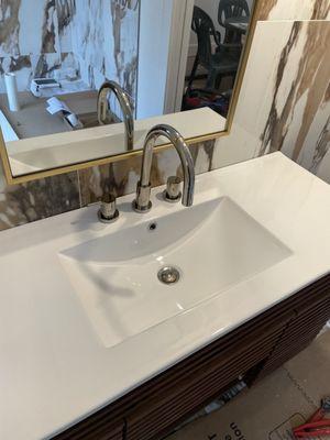 After: Bathroom sink and vanity installed