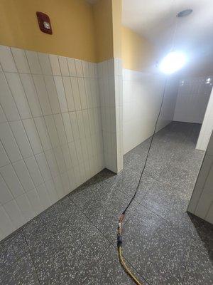 Commercial Restroom:
 Subway wall tile and 24x24 floor tile.