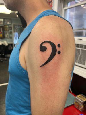 I'm a bass player and this bass clef tattoo has called to me for years! No regrets whatsoever.