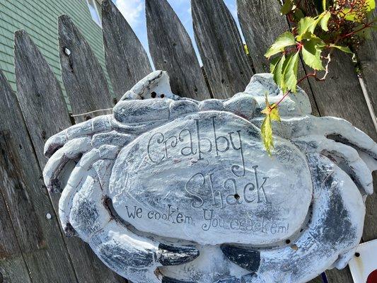 Cute sign hanging by the picnic table