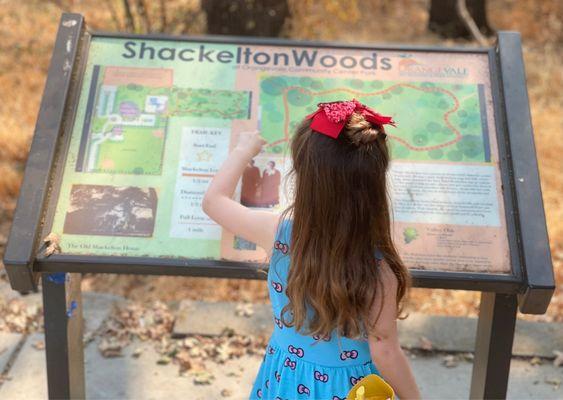 My daughter checking out their history, map, trail and playground!