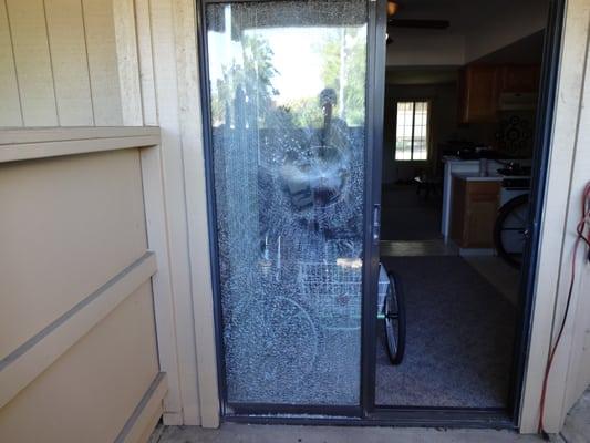 Replacement of glass in broken patio door.