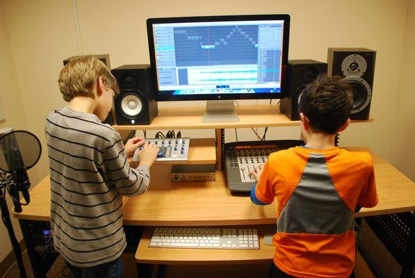 Students in our creative arts classes learning about music production in our studio.